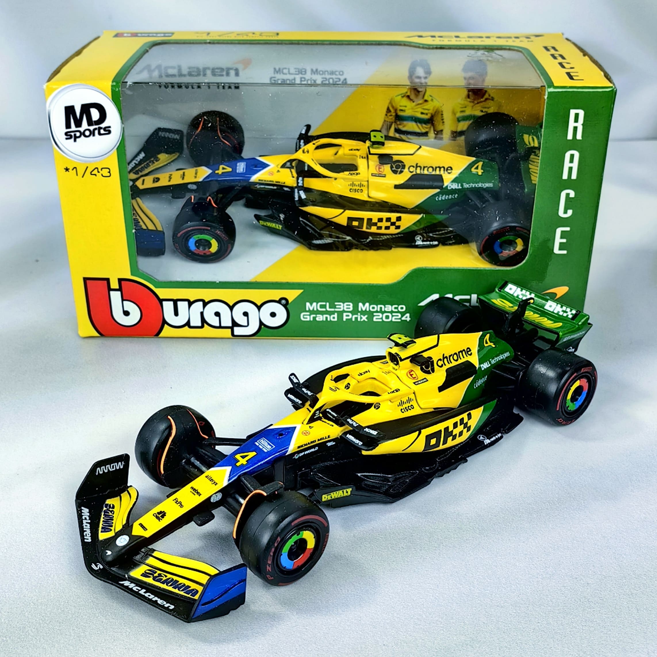 Bburago Negro mate/amarillo/verde 1:43 (GP Mónaco) (#4 Lando Norris) McLaren F1 MCL38 (con casco, caja acrílica)